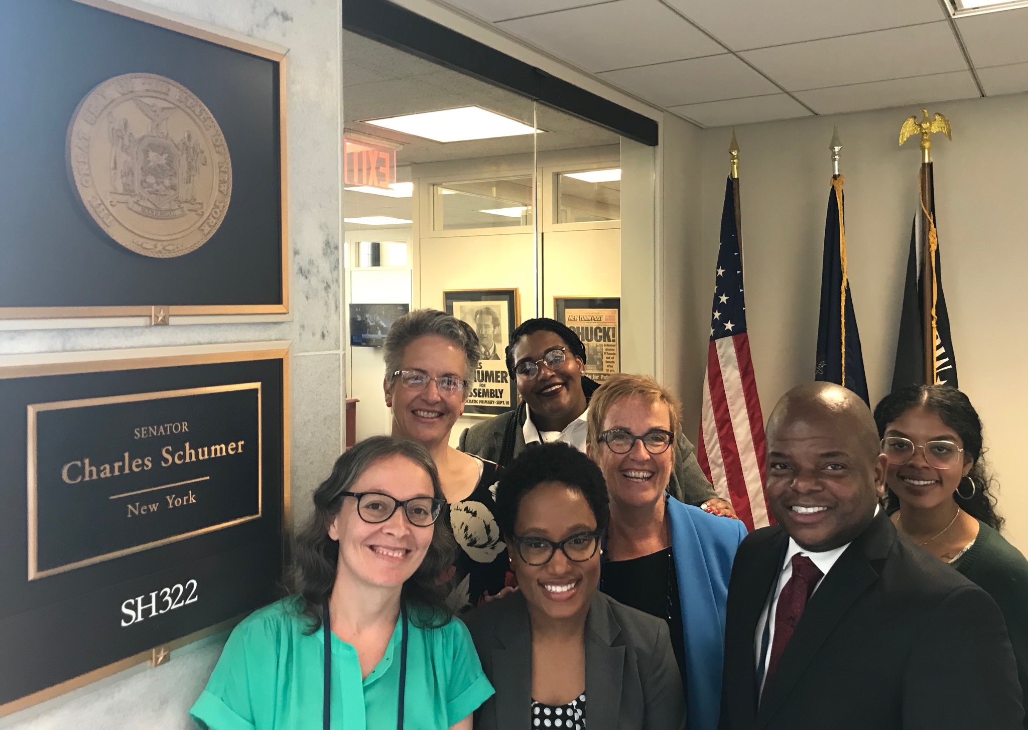 The New York State Chapter of the American Association of Colleges for Teacher Education (AACTE) including GSE Dean Jacob Easley II pose in front of Senator Schumer's office.
